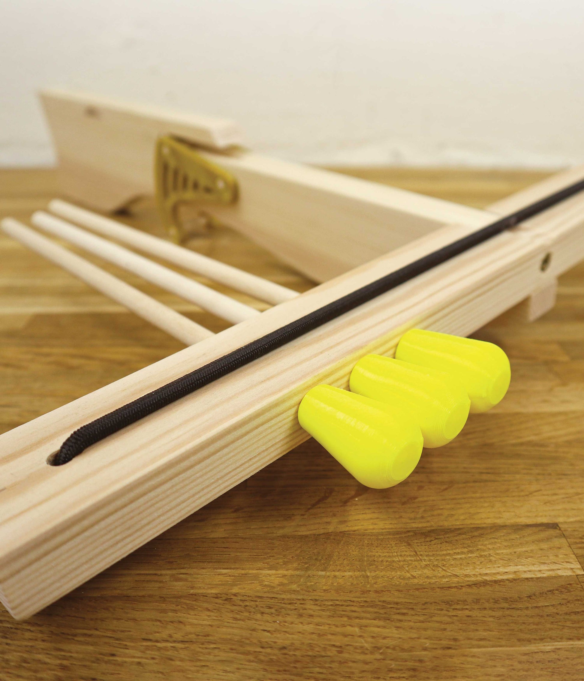 Make a wooden toy crossbow with soft ends - build and learn new skills at home with a woodworking kit for young makers.