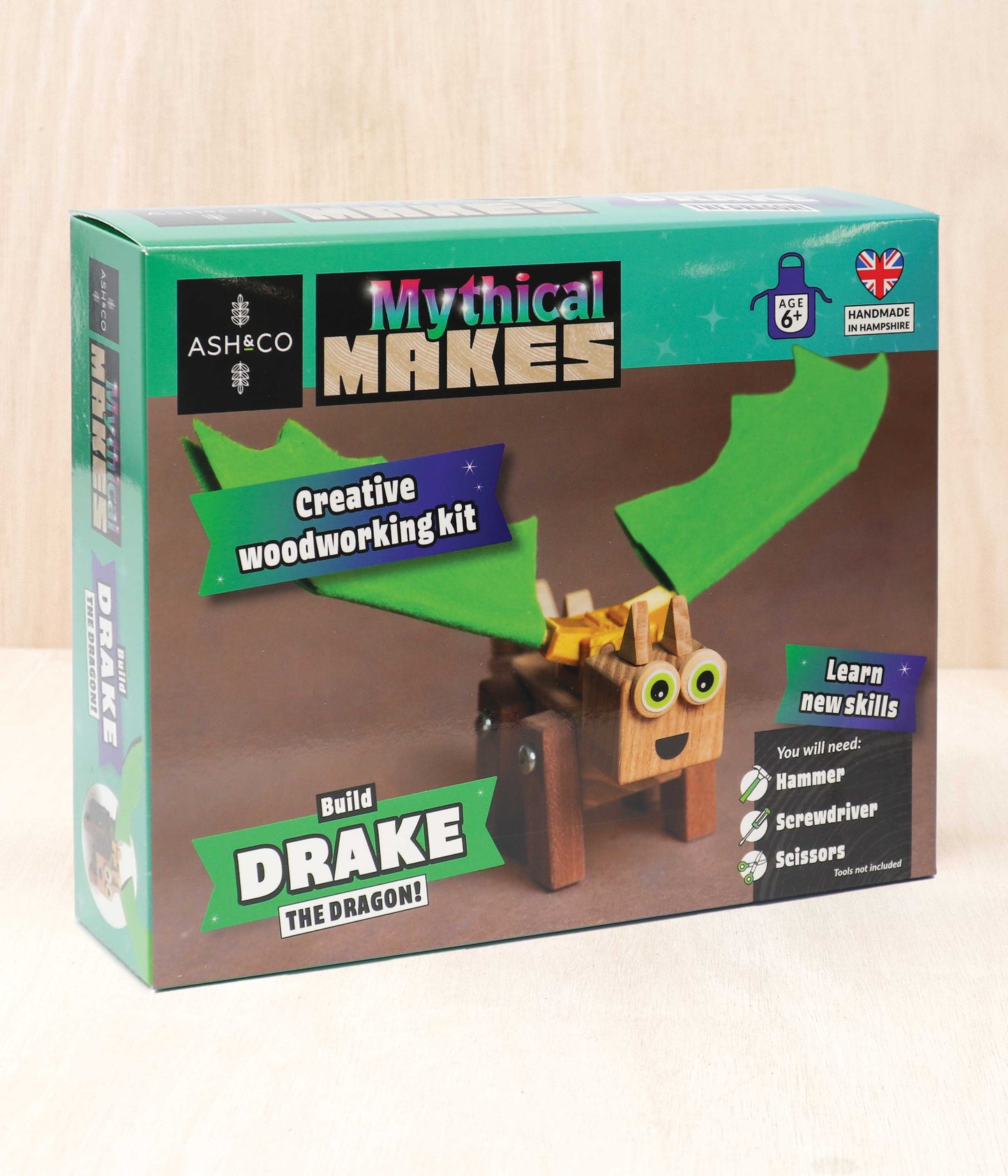 A close up for the packaging for the Build Drake the Dragon Mythical Makes wood craft kit for kids