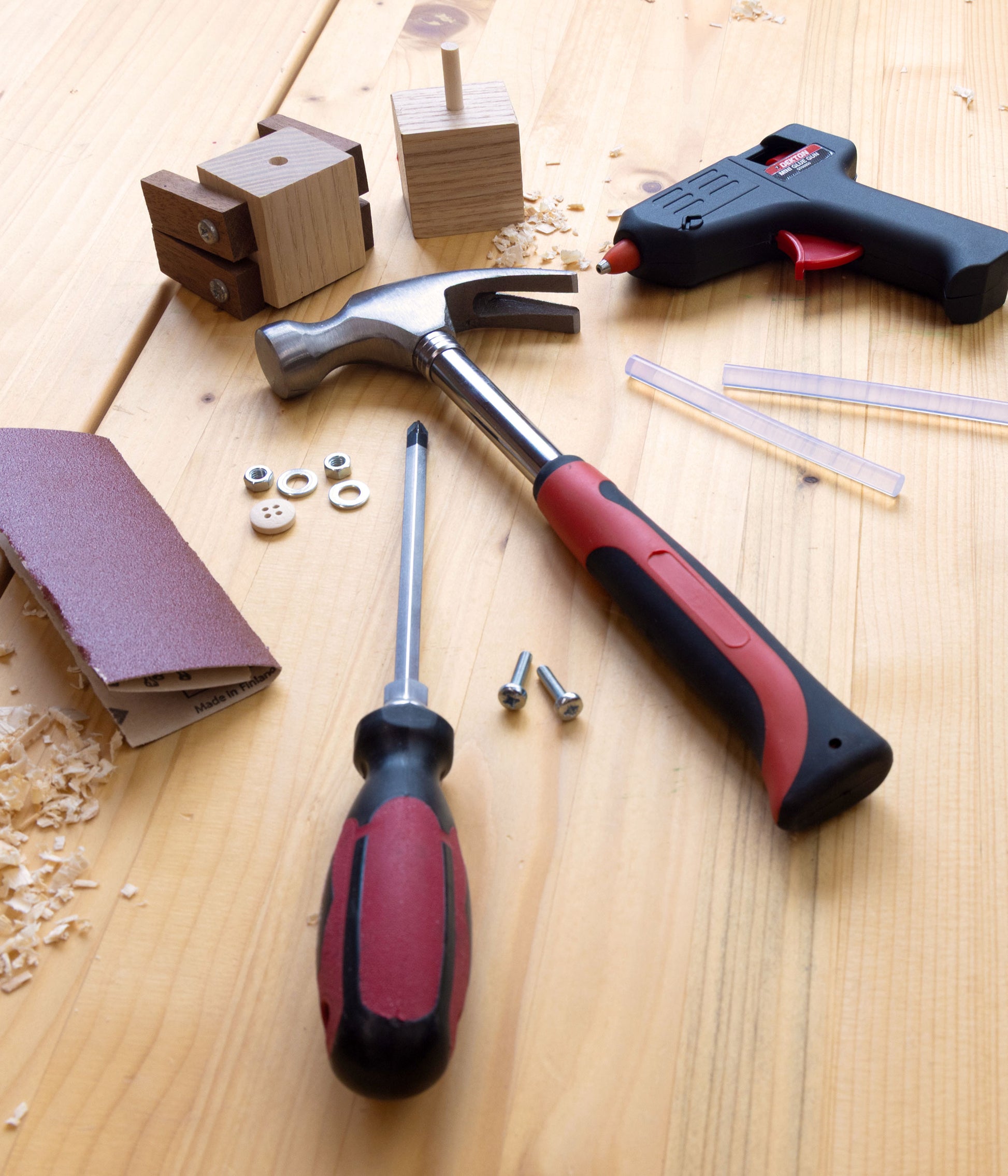Mini Maker tool kit including a hammer, screwdriver, sandpaper and glue - use to build Ash & Co woodworking make-at-home kits.