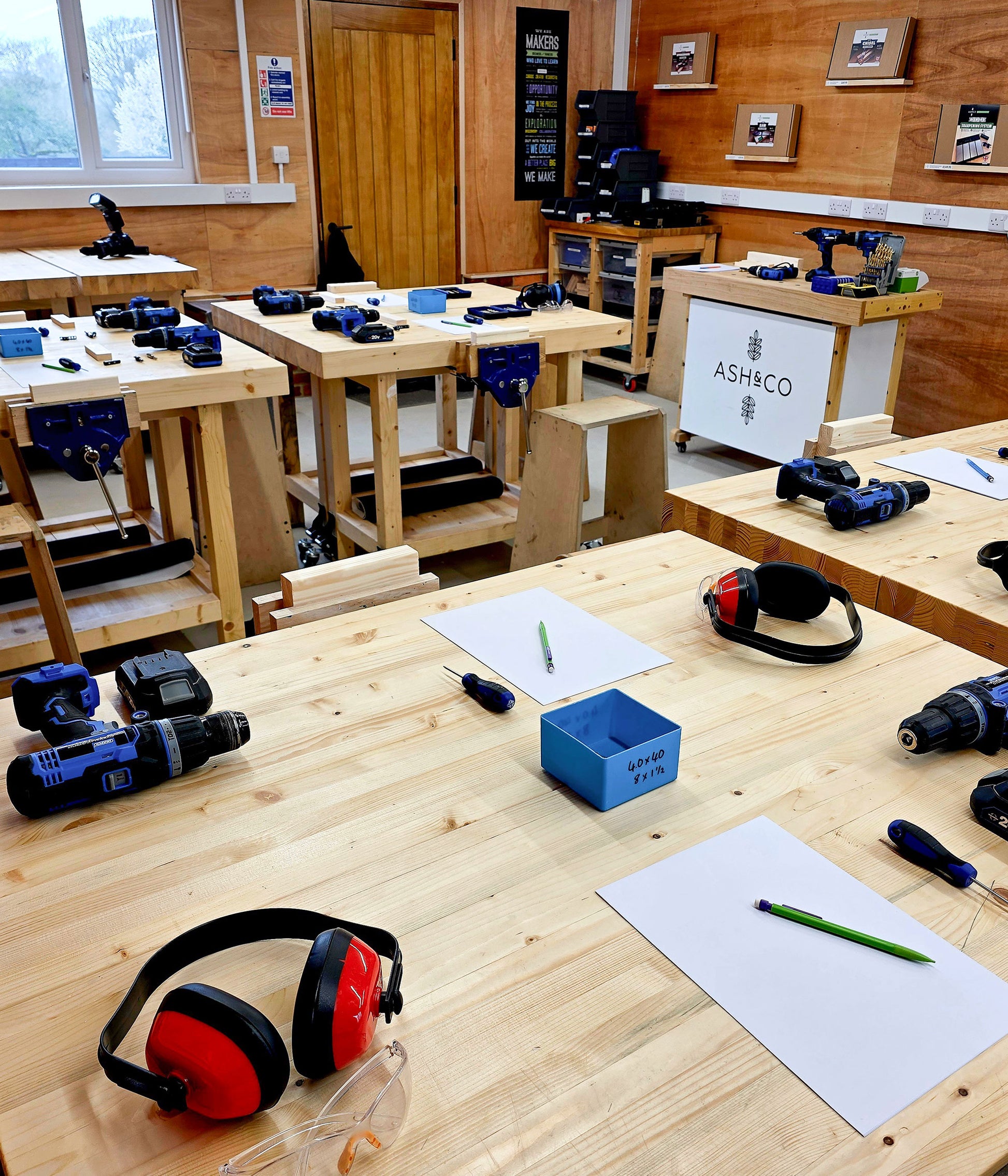 DIY workshop classroom set up with benches, drills and tools