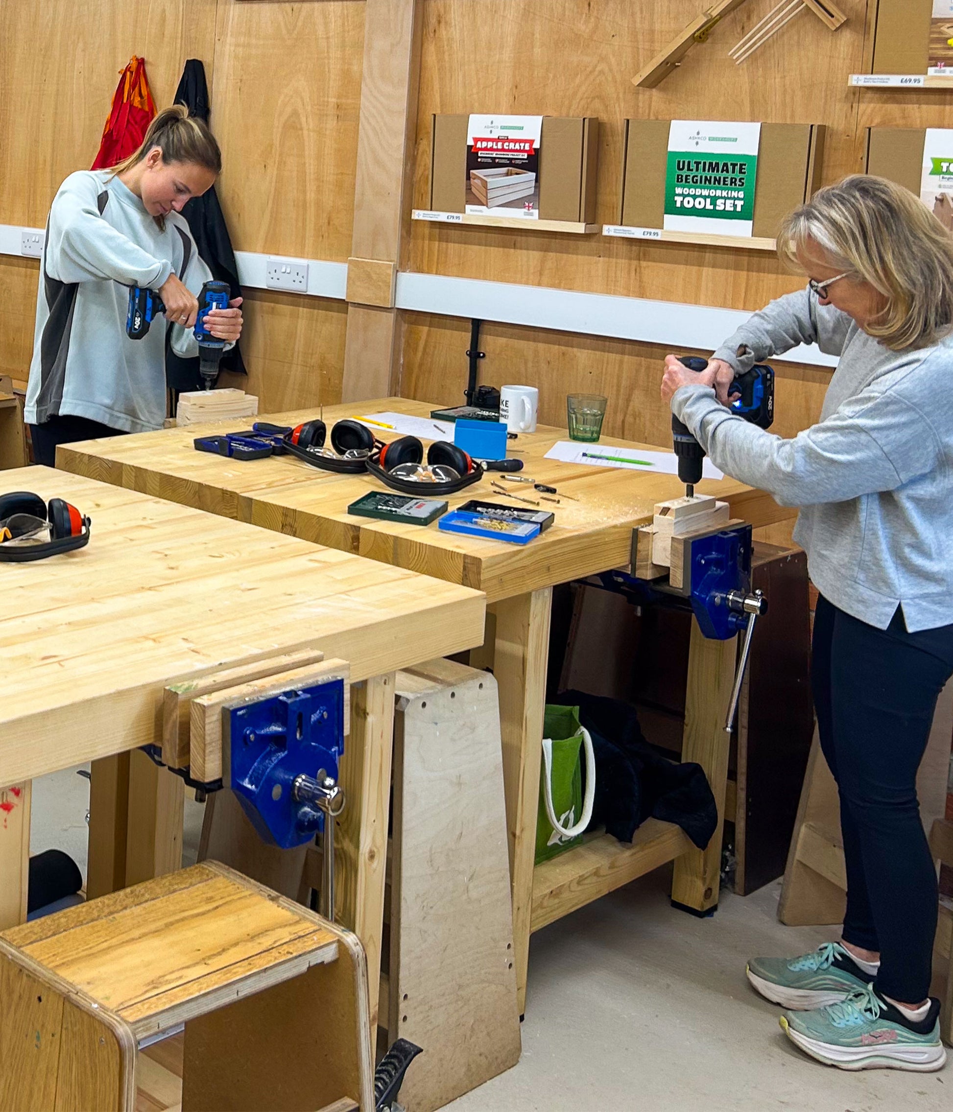 Students practising drilling during beginner DIY training workshop