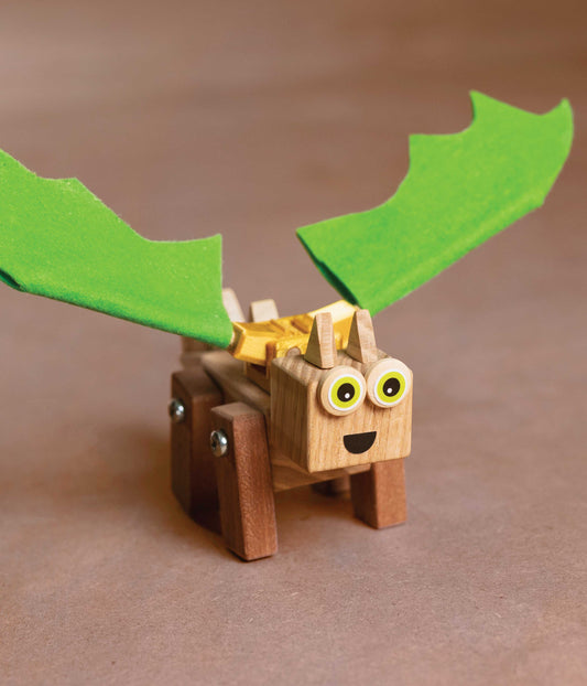 The finished wooden dragon model on display, showcasing the craftsmanship possible with our dragon craft kit for kids.