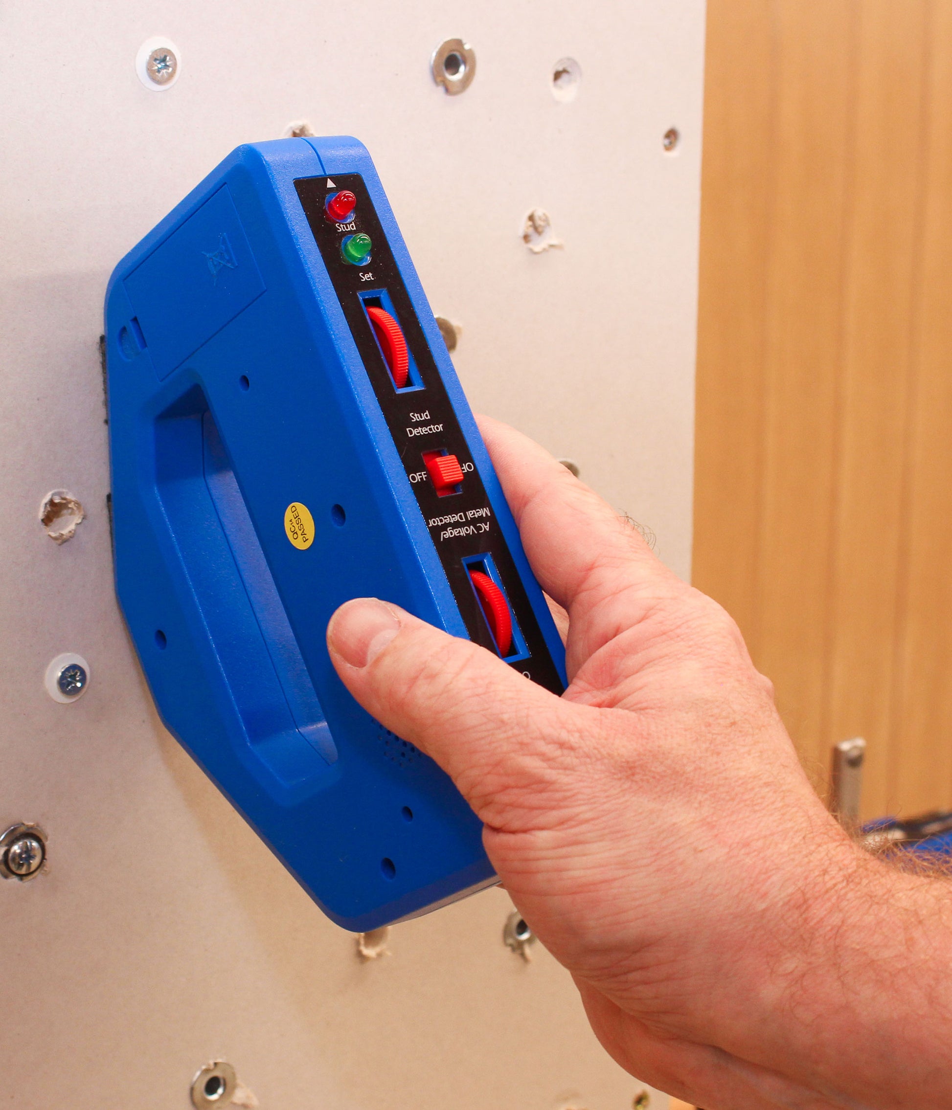 Learn how to use a stud detector to locate studs before drilling into walls