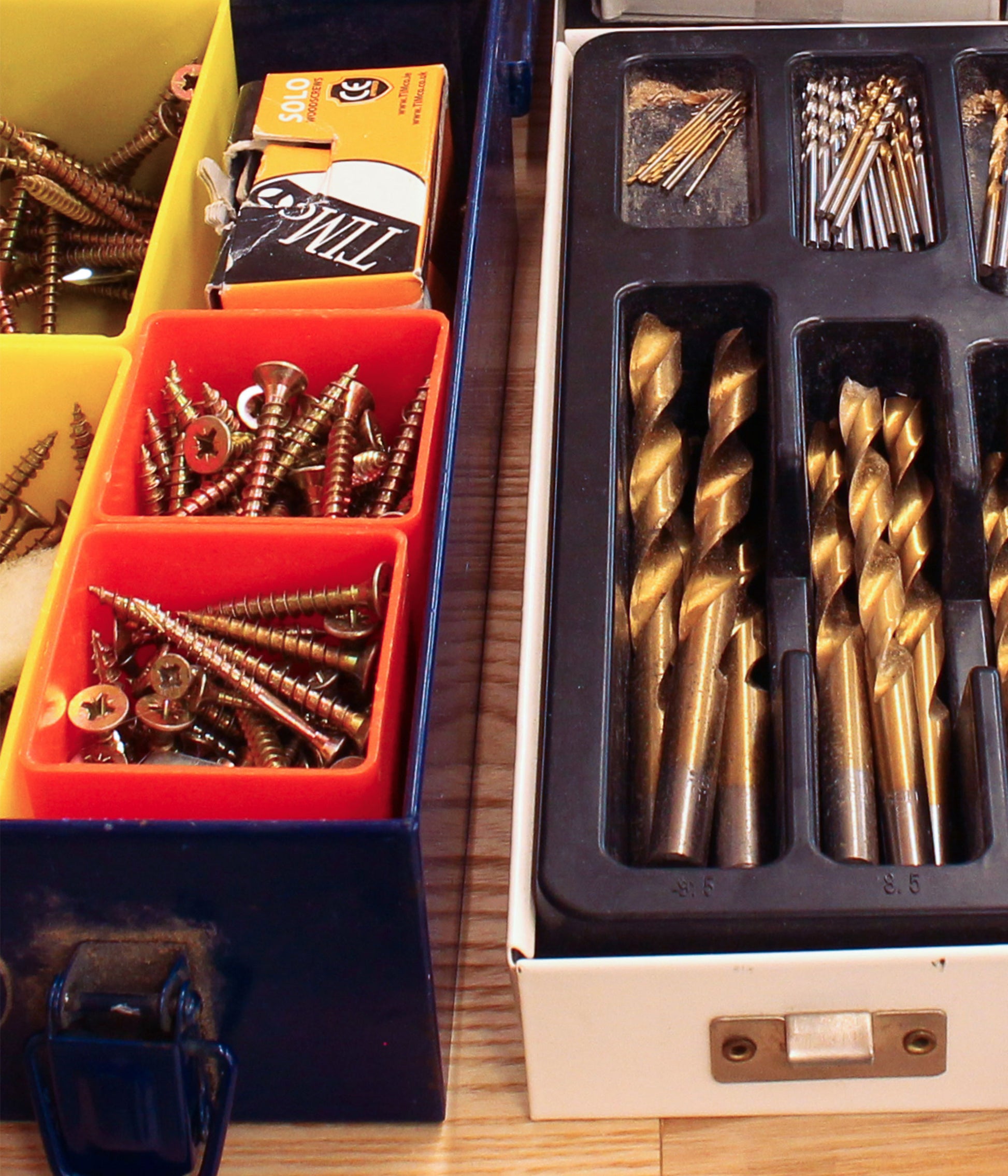 Organised screws and drill bits used in DIY skills workshop