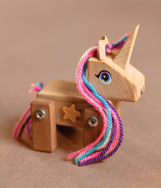 Close-up of the Ash & Co wooden unicorn model from our unicorn craft kit for kids, highlighting the quality and detail.