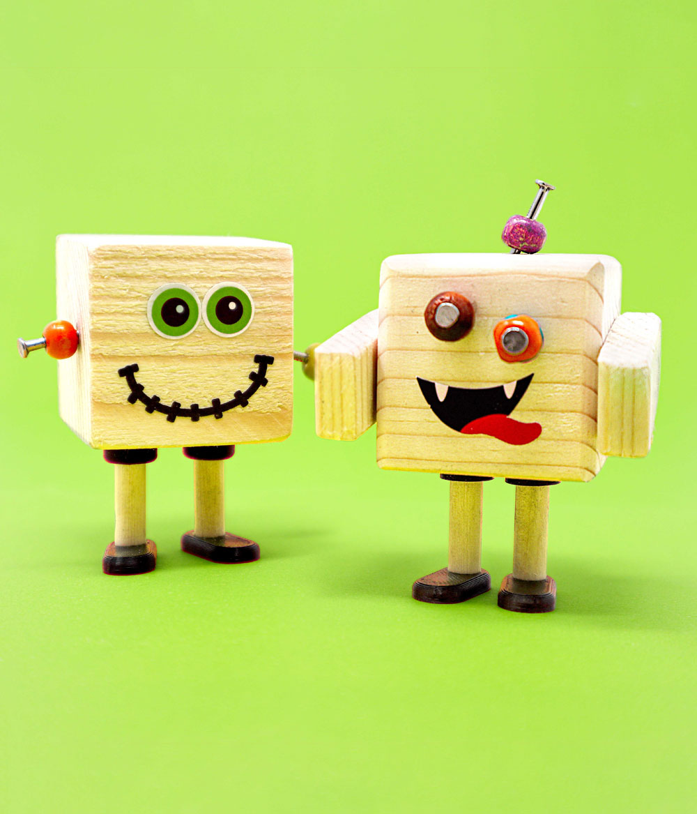 Children's introductory woodwork kit - build a pair of robots and learn hammering and nailing skills with the Ash & Co Young Woodworkers educational set for children.