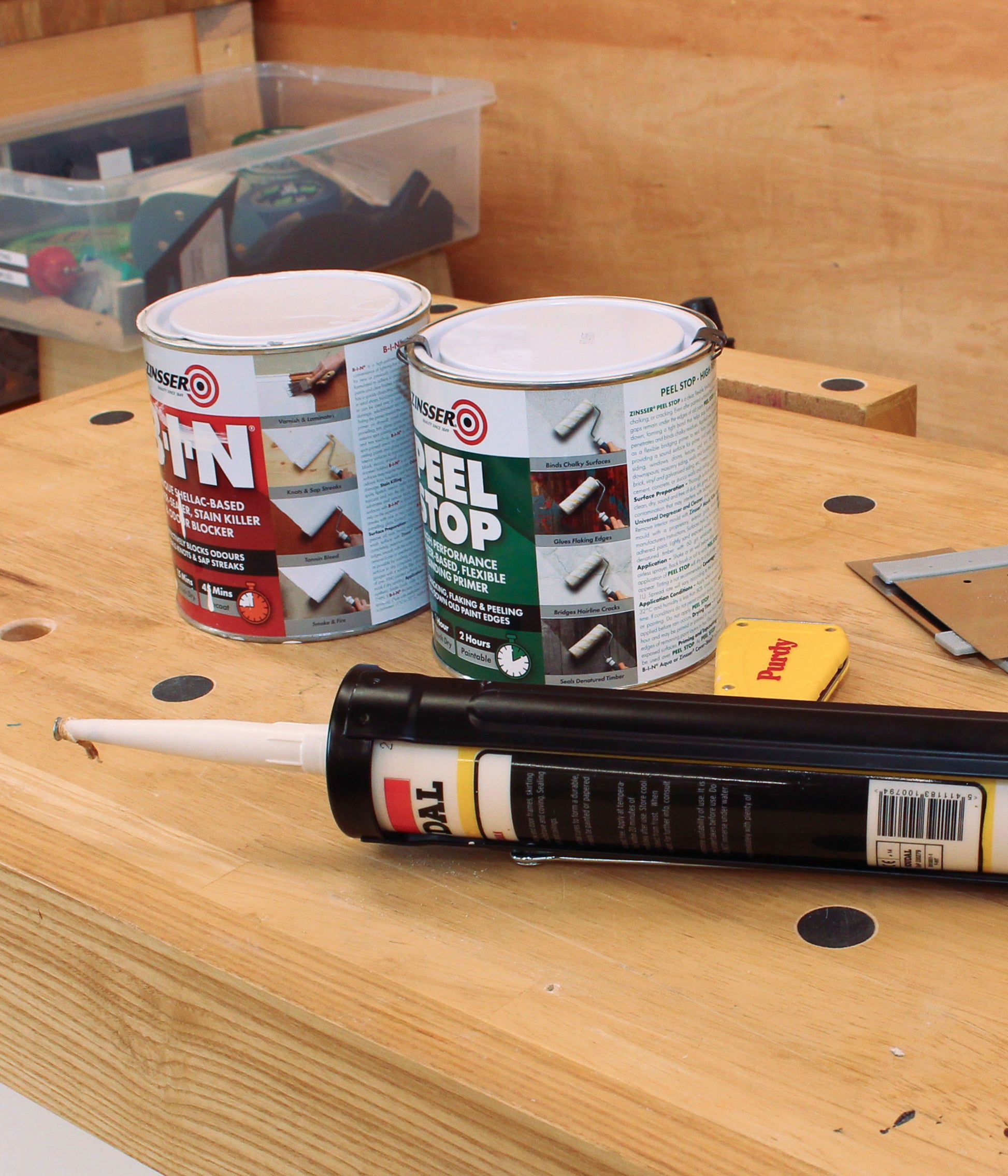 Caulking gun and decorating preparation tools used to teach professional decorating preparation skills on a beginner decorating course.