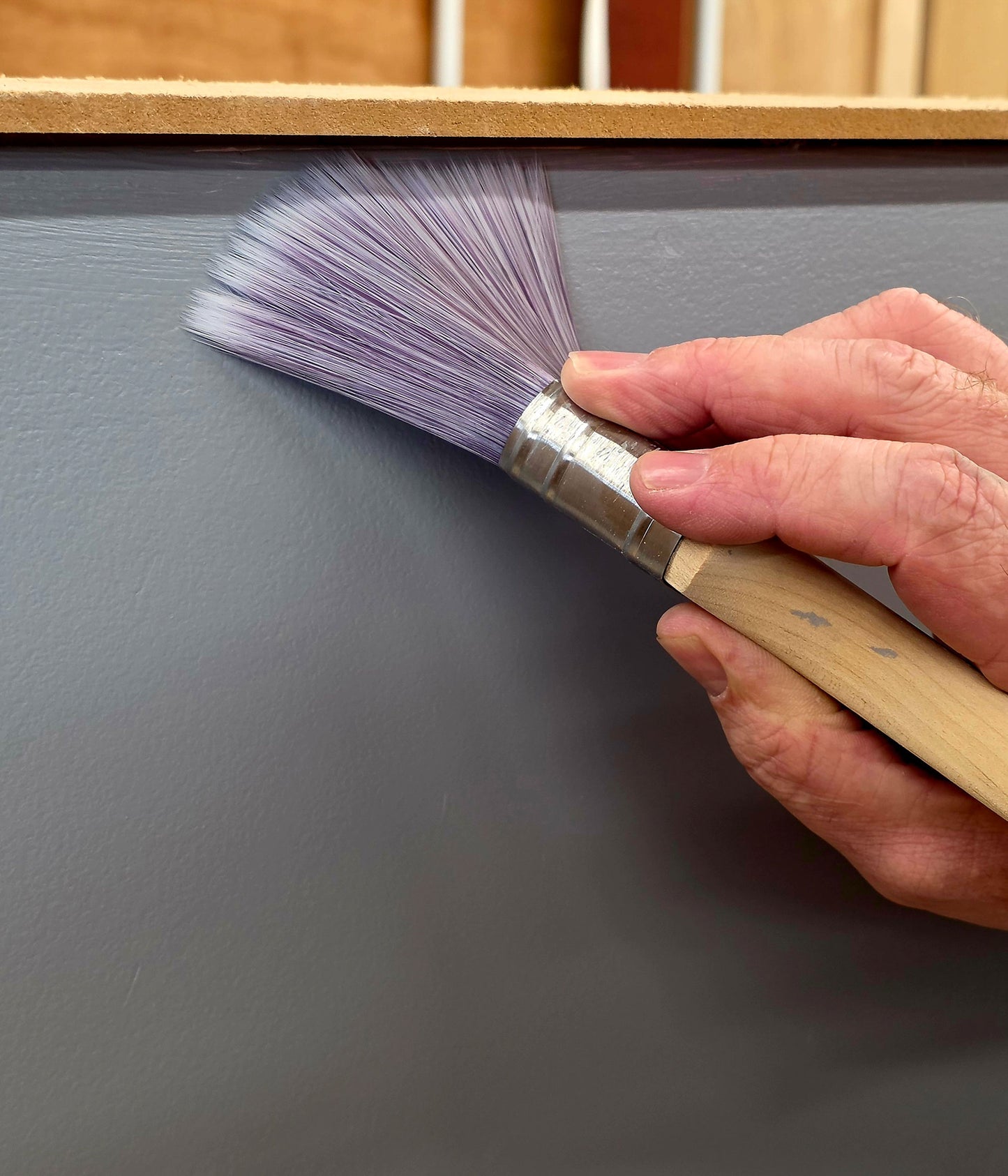 Close-up showing cutting in technique with a decorating brush for neat paint edges taught on the Decorate in a Day DIY decorating course.