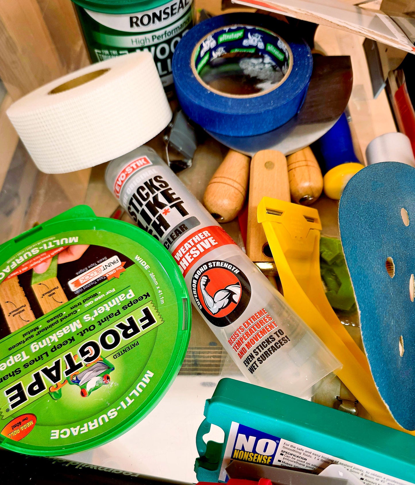 Decorating tools and supplies used on the Decorate in a Day DIY painting course at Ash & Co Workshops, showing masking tape, fillers and decorating equipment for beginners.