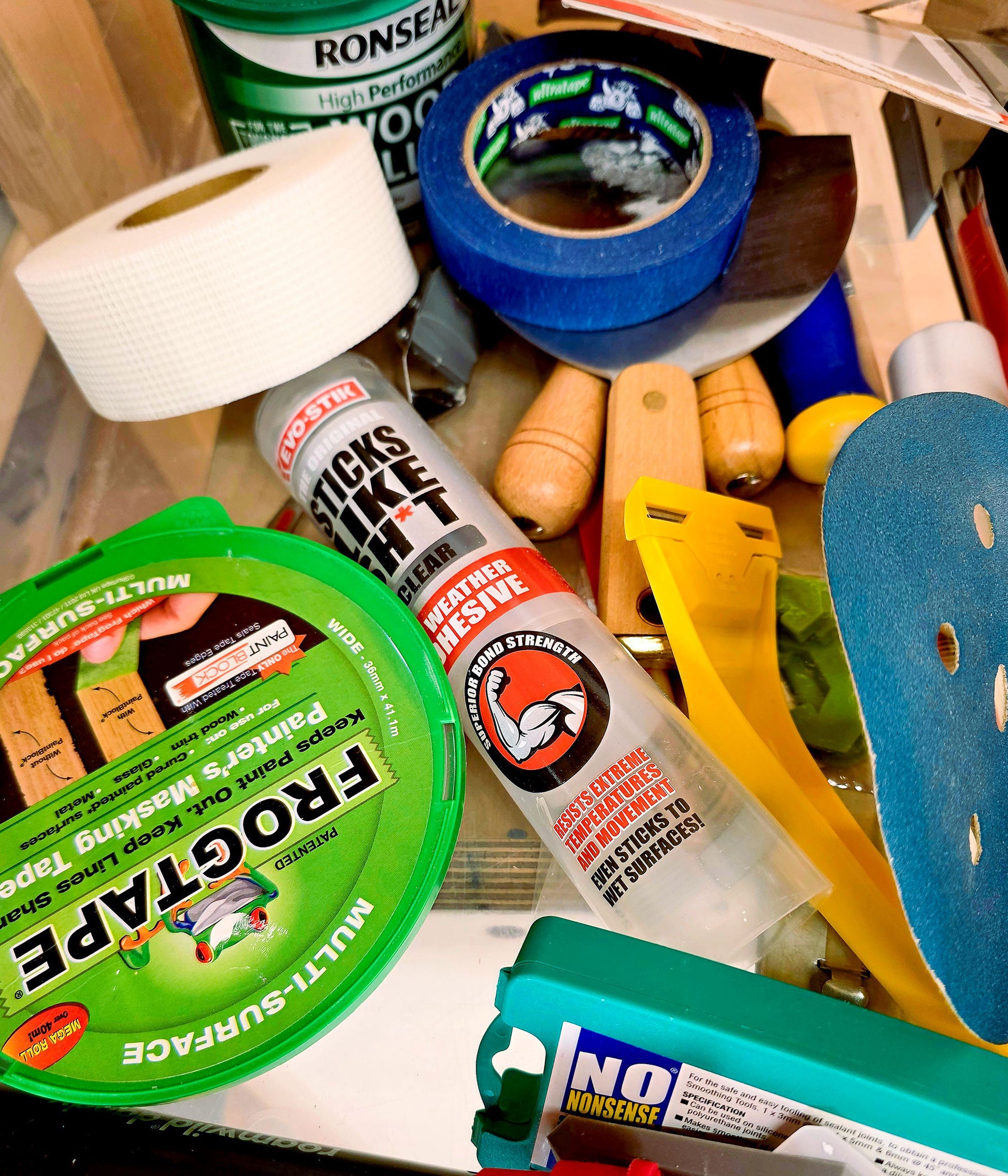 Decorating tools and supplies used on the Decorate in a Day DIY painting course at Ash & Co Workshops, showing masking tape, fillers and decorating equipment for beginners.